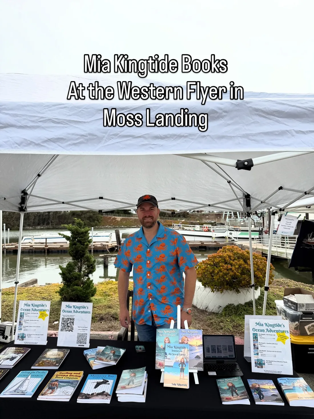 Luke Kilpatrick at his Mia Kingtide books table at the Western Flyer in Moss Landing