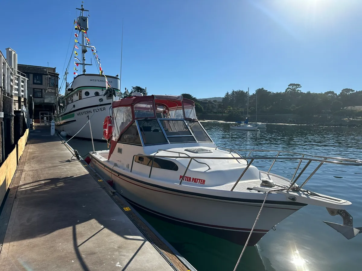 Luke Kilpatrick's dive boat Pitter Patter docked beside the historic research vessel Western Flyer in Moss Landing harbor