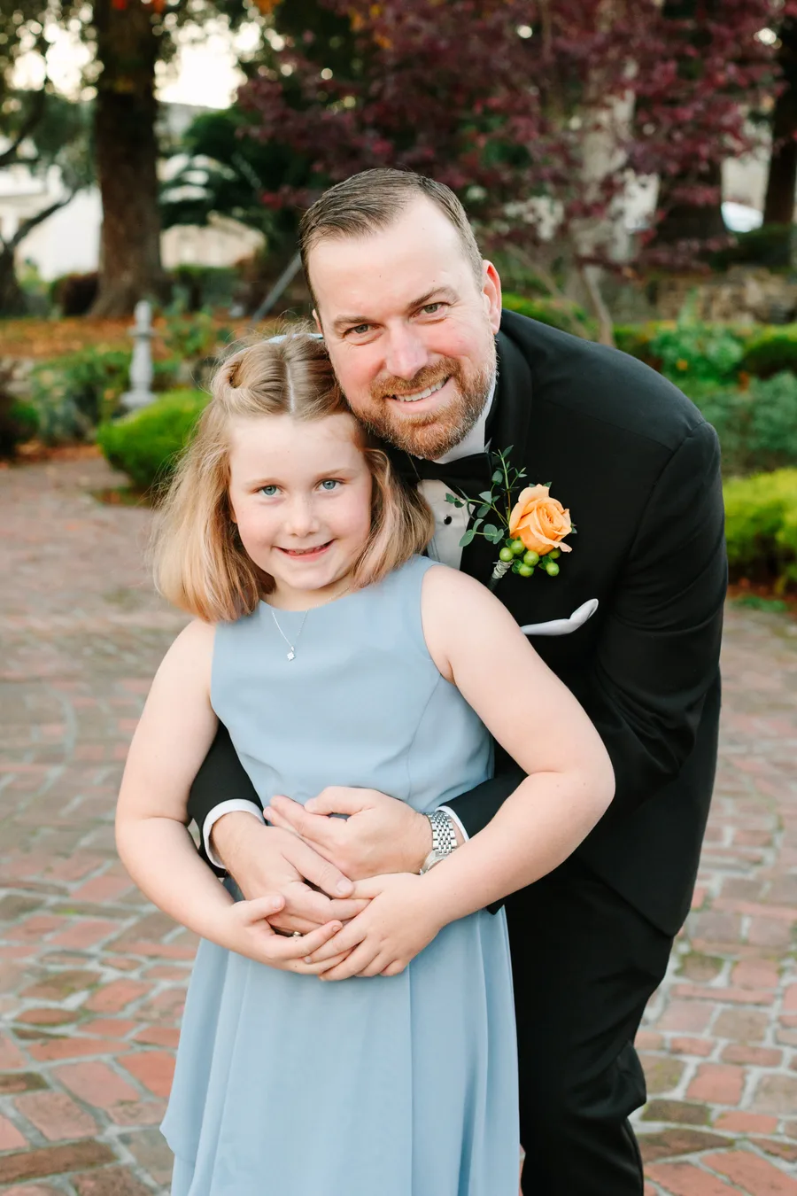 Luke Kilpatrick hugging his daughter Mia at the wedding